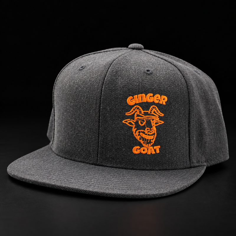 Grey Ginger Goat snapback with orange embroidered logo on a black background